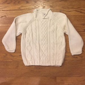 Child’s cable knit sweater